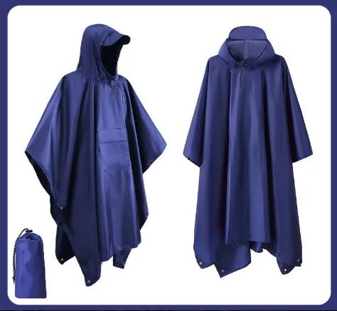 Model wearing a lightweight unisex waterproof rain poncho, perfect for hiking, camping & emergency outdoor protection.