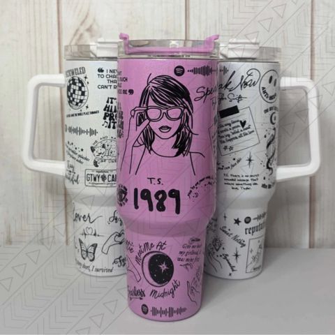"Limited edition stainless steel tumbler with custom design, handwritten lyrics, vibrant colors, and ergonomic handle."