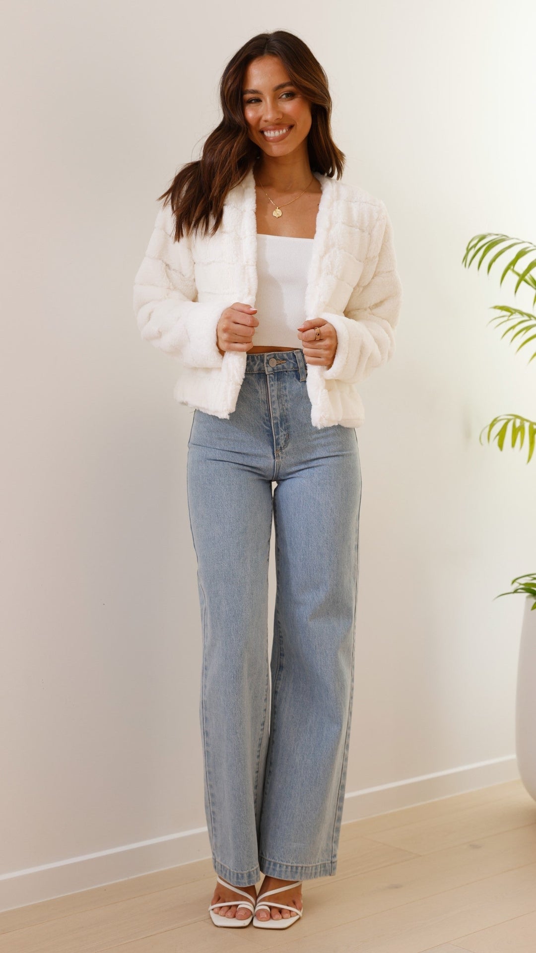 Stylish women's cropped Veloura jacket, elegant for winter outerwear collection.