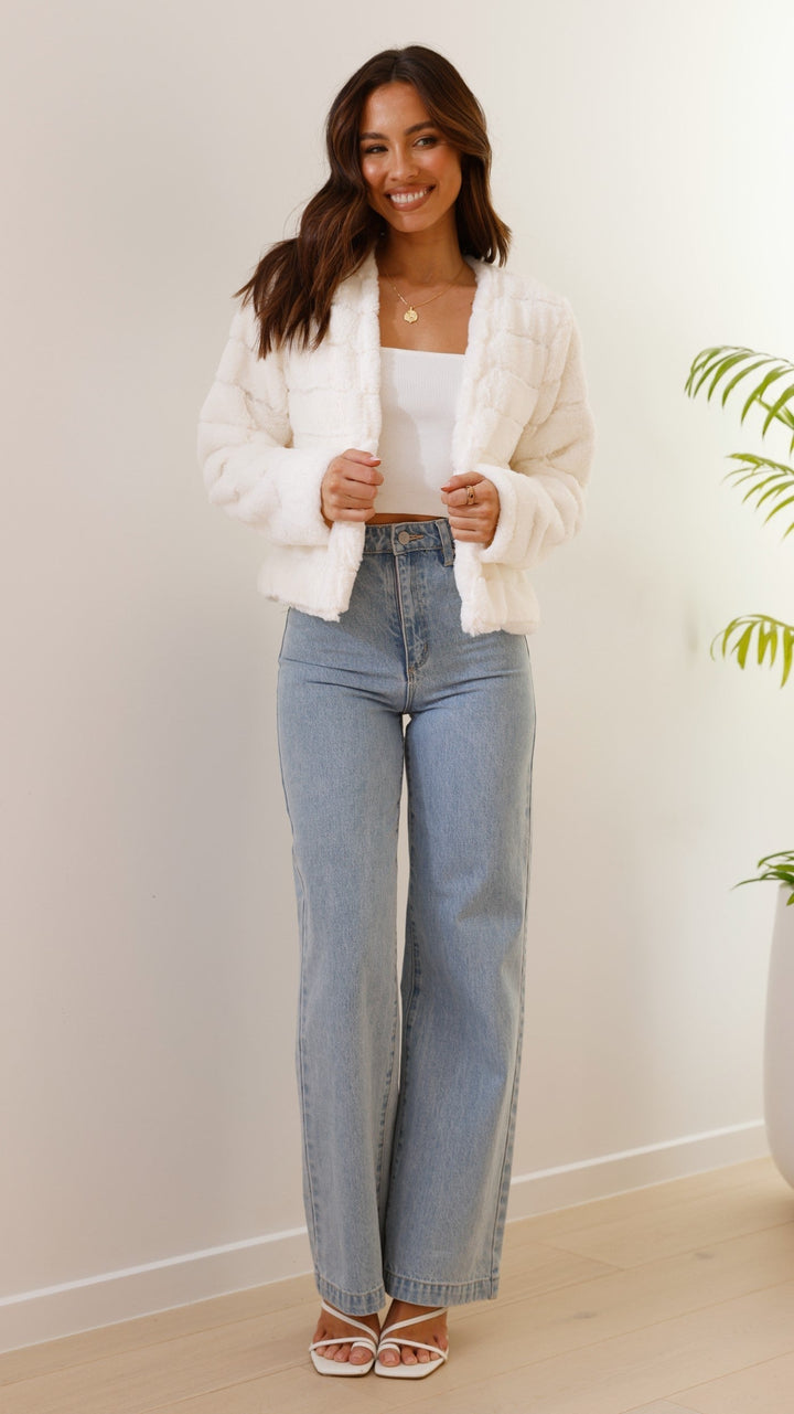 Stylish women's cropped Veloura jacket, elegant for winter outerwear collection.