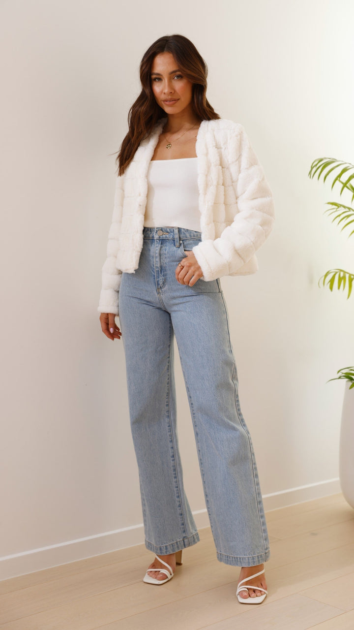 Luxurious Veloura cropped jacket for women, elegant fashion outerwear.
