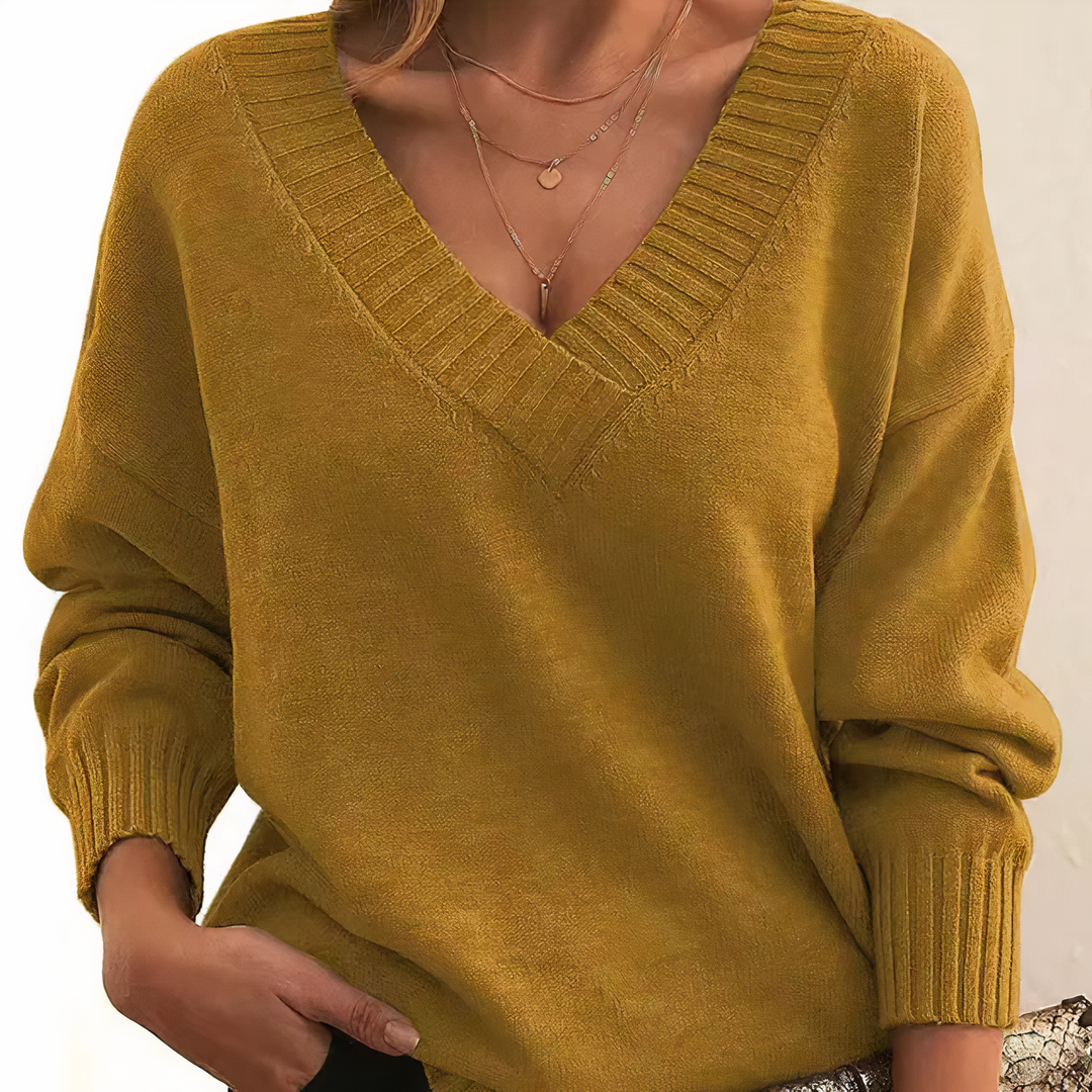 Ladies' luxurious v-neck knitwear, stylish long-sleeve top for casual or elegant wear.