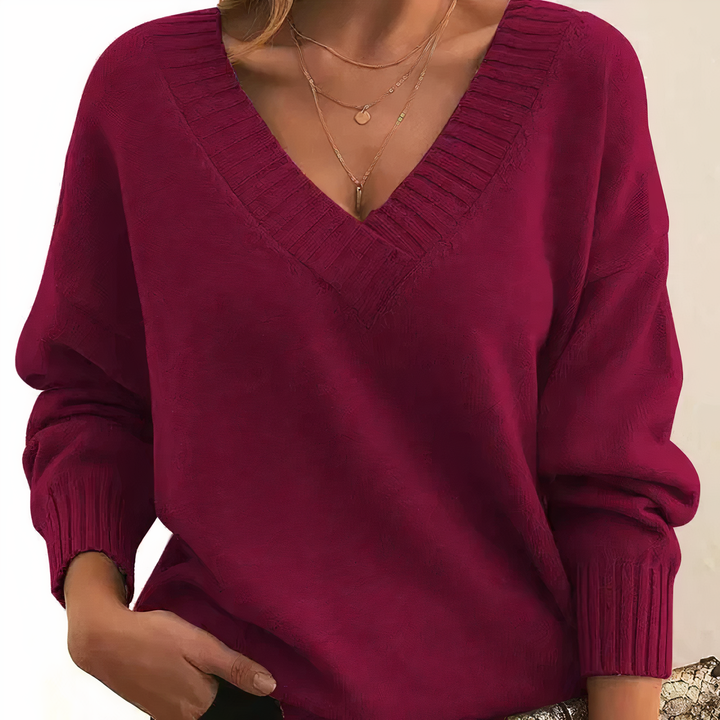 Women's v-neck jumper, cozy long-sleeve top perfect for winter comfort.