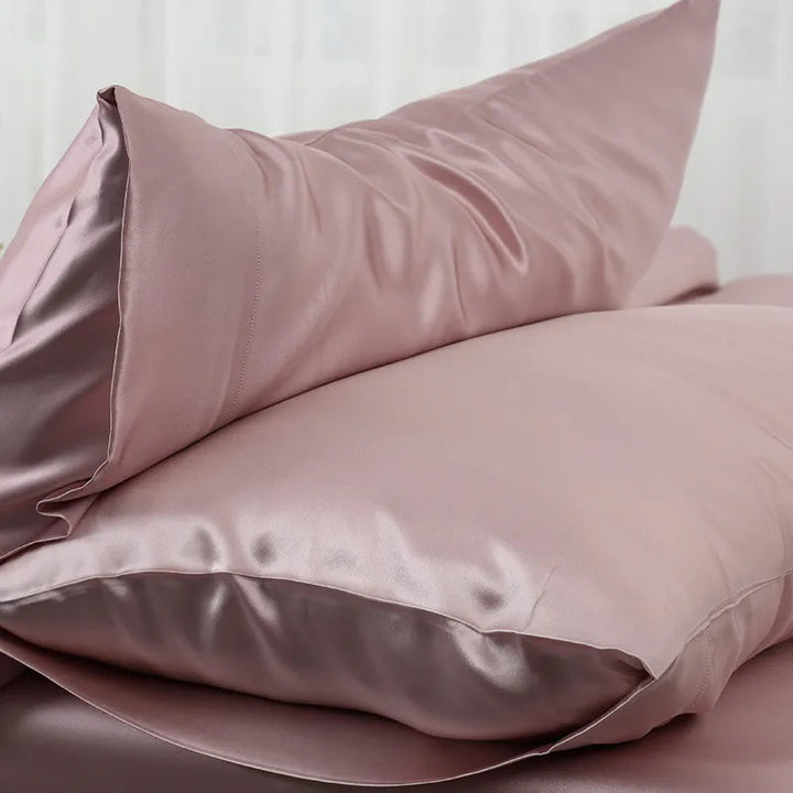Luxurious mulberry silk pillowcase, unisex, pure silk, close-up of elegant smooth texture enhances skin and hair health.