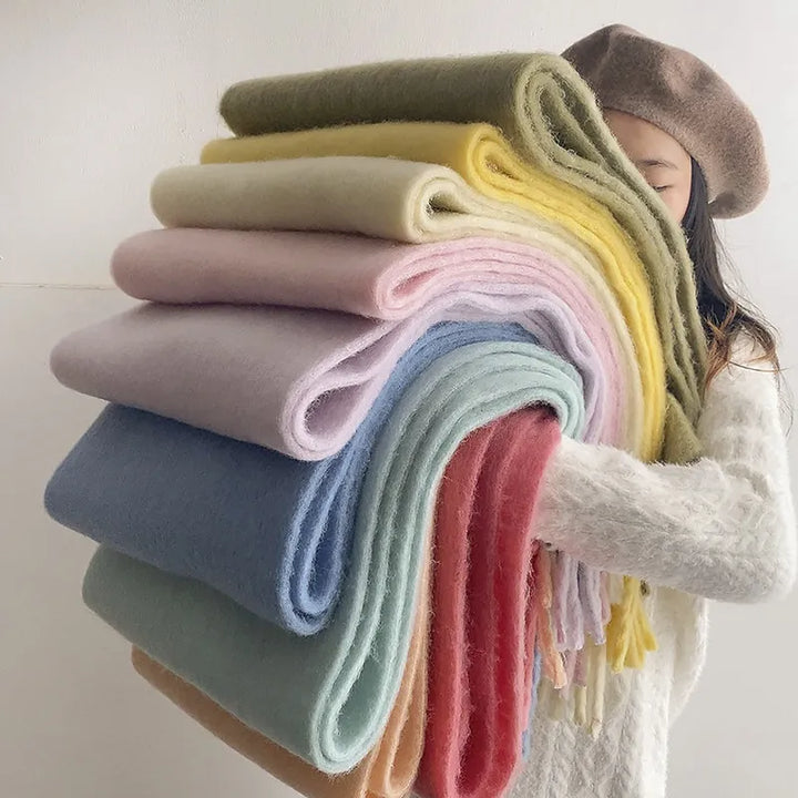 Soft and warm women's cashmere scarf, perfect for gifting. A luxury winter fashion item.