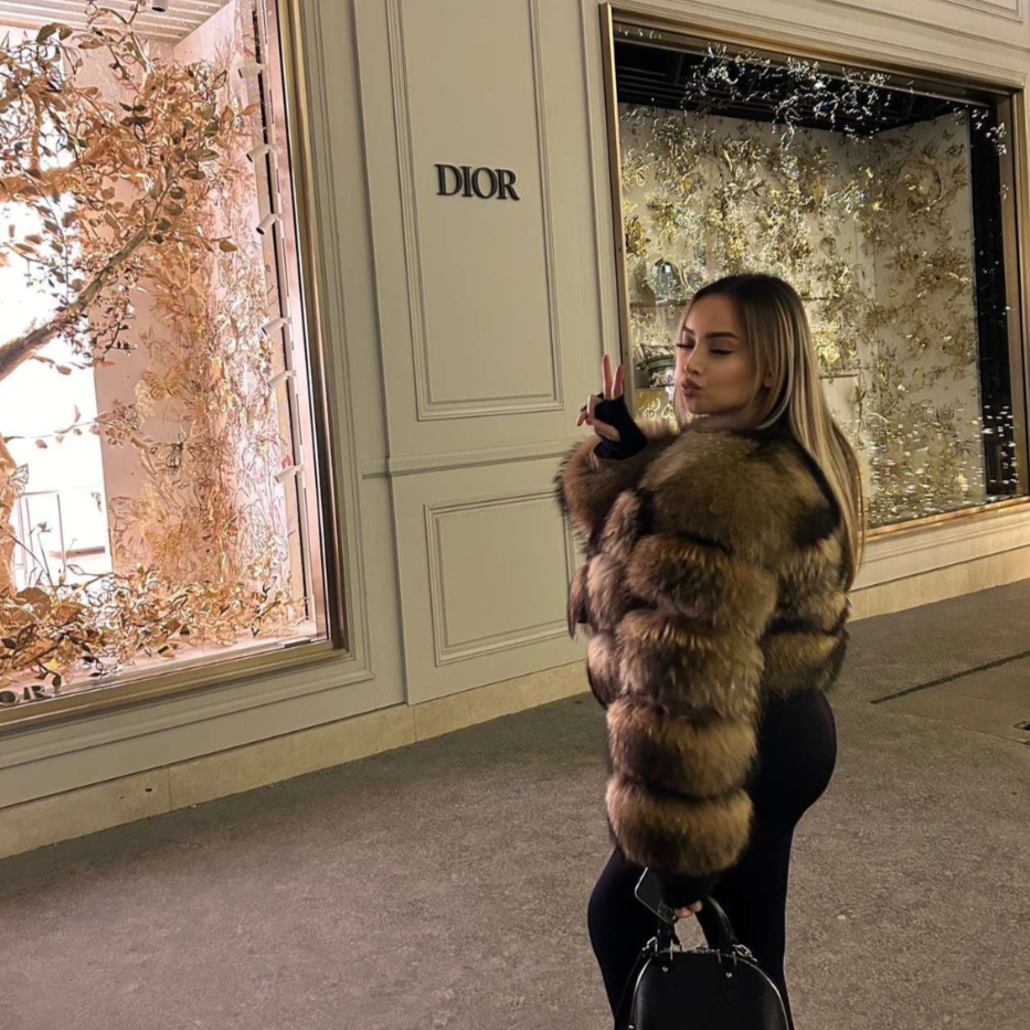 Warm women's faux fur jacket. This elegant cold weather coat provides cozy comfort and a sophisticated look.