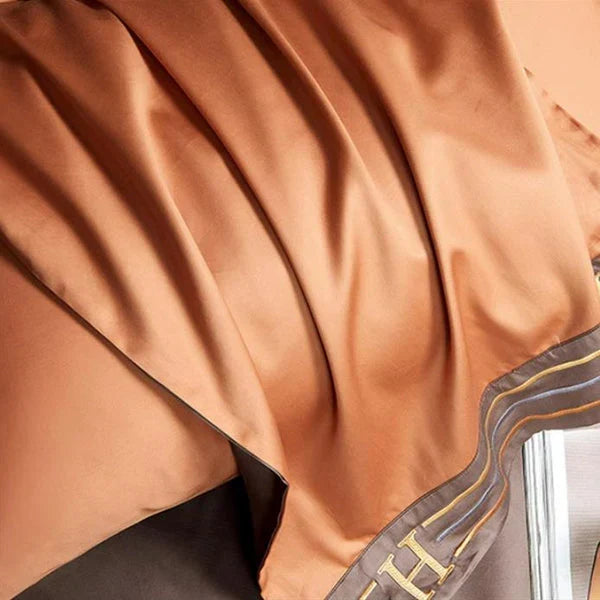 Close-up of intricate embroidery detail on a luxury soft cotton duvet cover from the bedding set.