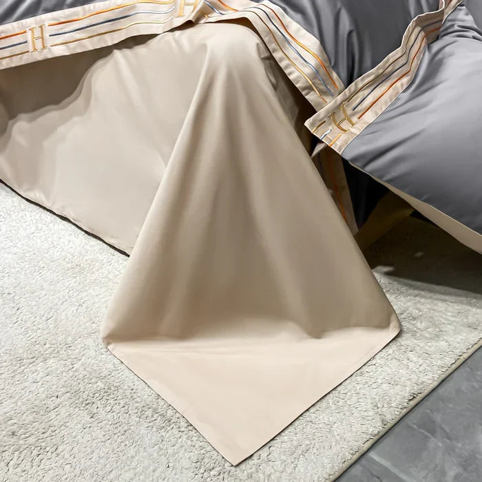 Luxury embroidered duvet cover, soft cotton sheets, and pillowcases for a sophisticated bedroom.