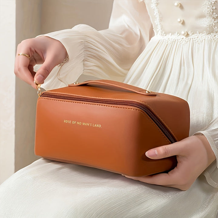 Women's PU leather cosmetic case; elegant travel toiletry bag with zipper.