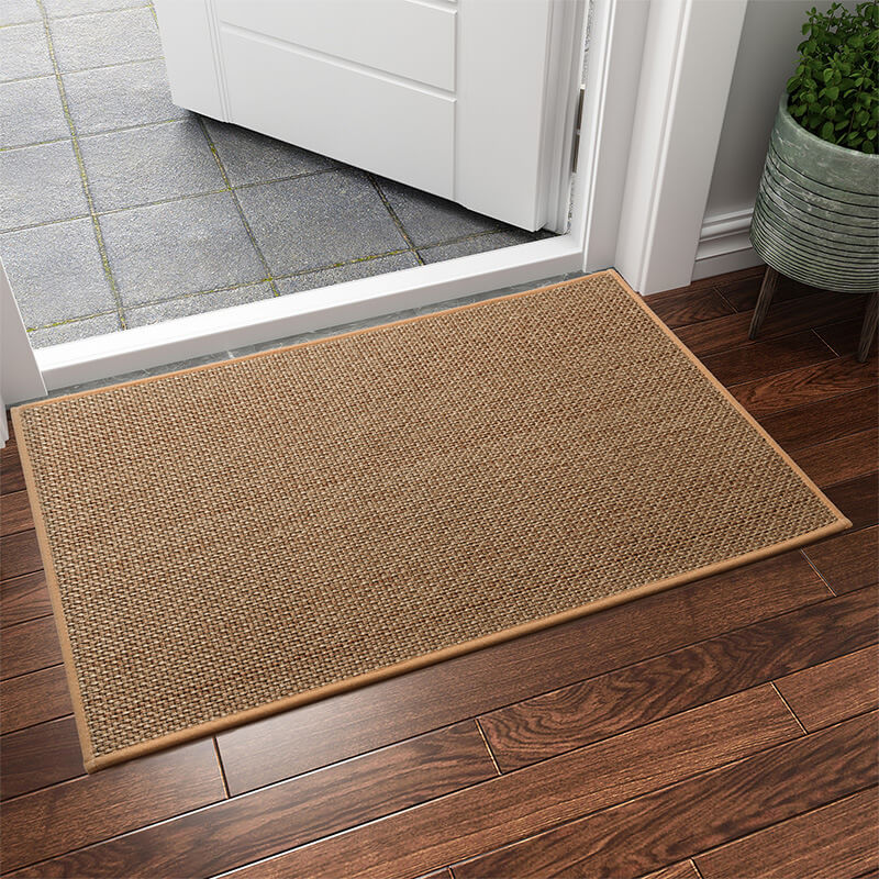 Machine washable woven indoor door mat with a timeless weave pattern, non-slip backing, and plush polypropylene surface.