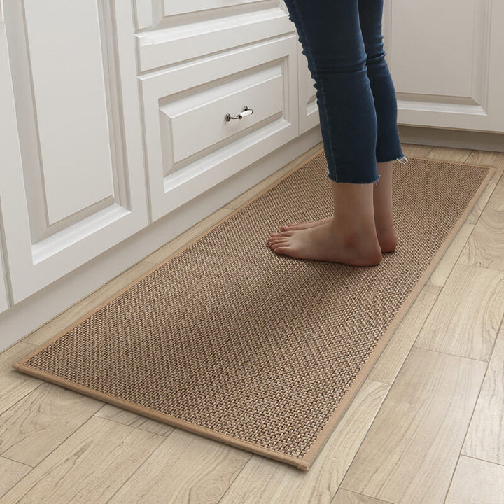 Machine washable woven indoor door mat with a timeless weave pattern, non-slip backing, and plush polypropylene surface.