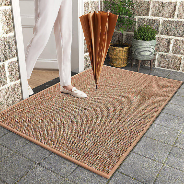 Machine washable woven indoor door mat with a timeless weave pattern, non-slip backing, and plush polypropylene surface.