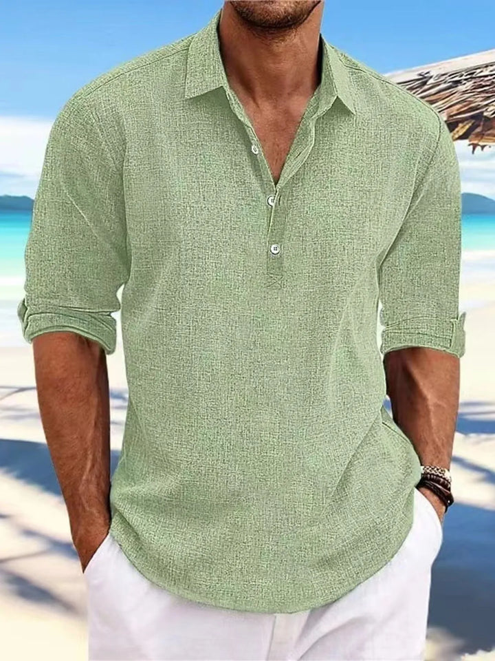 Close-up of white men's lightweight short sleeve polo, showing breathable fabric for summer fashion.