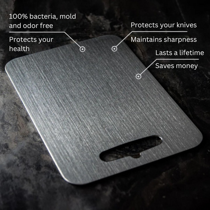 Medical grade titanium cutting board with non-porous silver surface, rounded edges, and ergonomic design for ultimate hygiene
