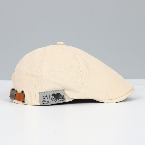 Close-up of men's adjustable beret hat showing interior strap for custom fit & comfort. Stylish accessory.