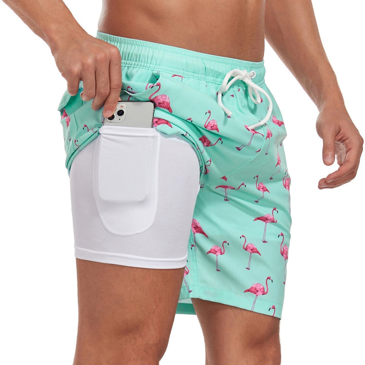 Men's quick-dry swim trunks in a stylish summer print. Perfect drawstring shorts for beach or pool.