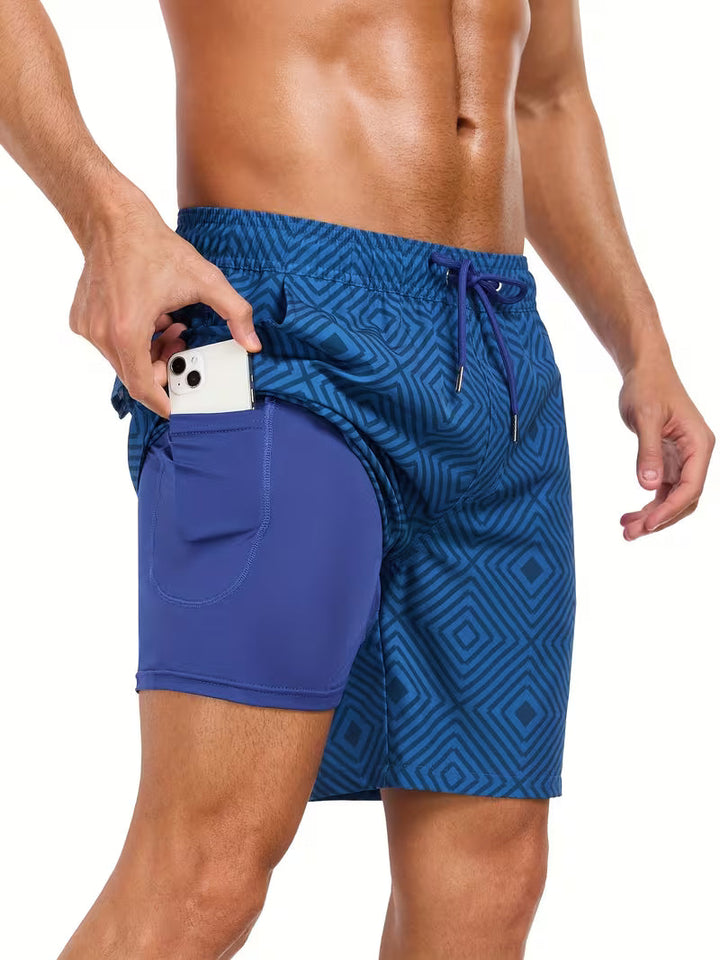 Men's tropical leaf print drawstring swim shorts. Versatile men's swimwear for resort, vacation, or summer fashion.