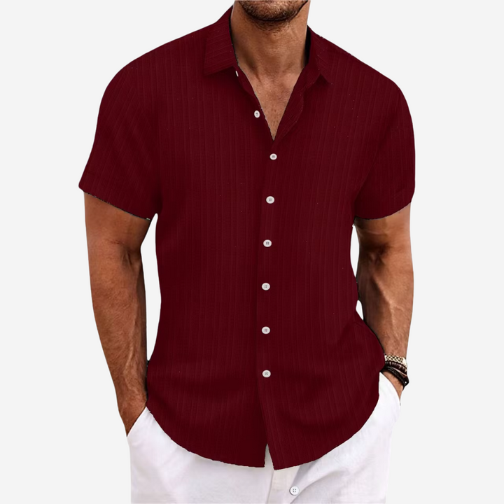 Regular fit men's casual short-sleeve button-up shirt, a breathable top designed for summer comfort.
