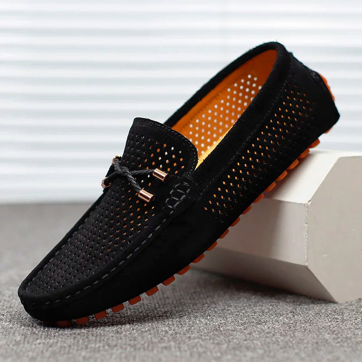 Stylish grey men's casual slip-on loafers. Comfortable everyday footwear with a classic design for versatility.