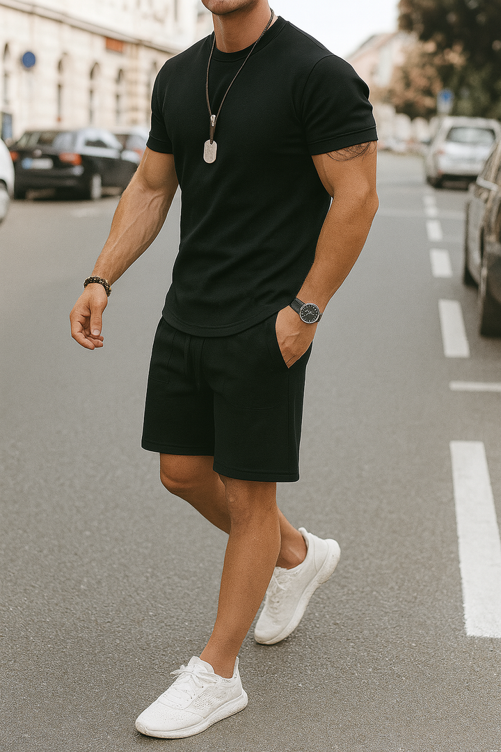 Versatile men's coordinated summer outfit set: a casual short-sleeve top and matching shorts for easy style.