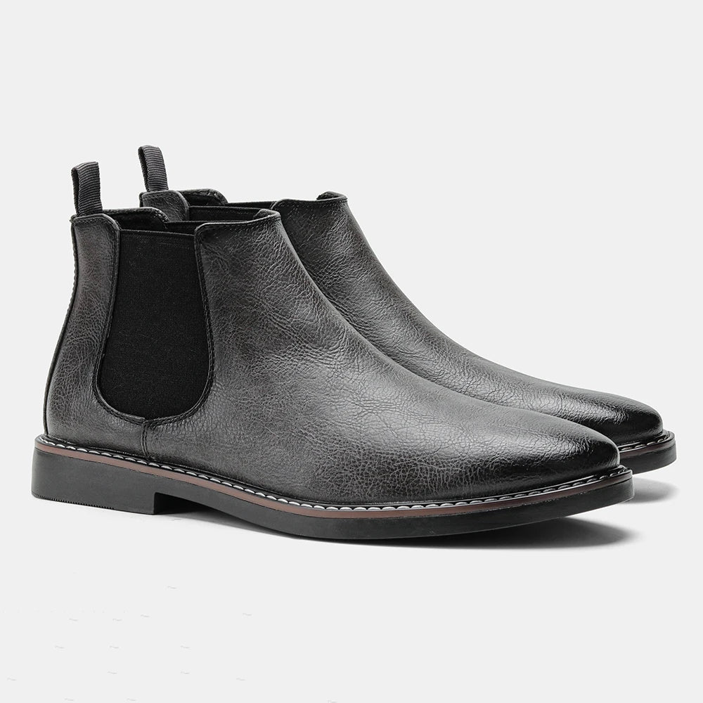 Durable sole of men's slip-on black Chelsea boots, designed for comfort and traction in everyday wear.