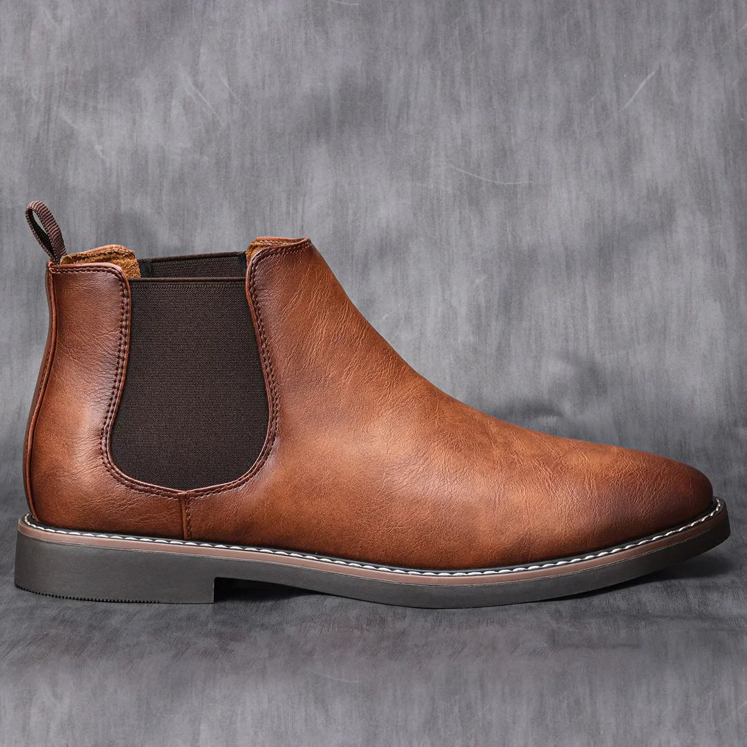 Men's stylish black Chelsea boots, paired with jeans for a modern casual fashion look & everyday comfort.