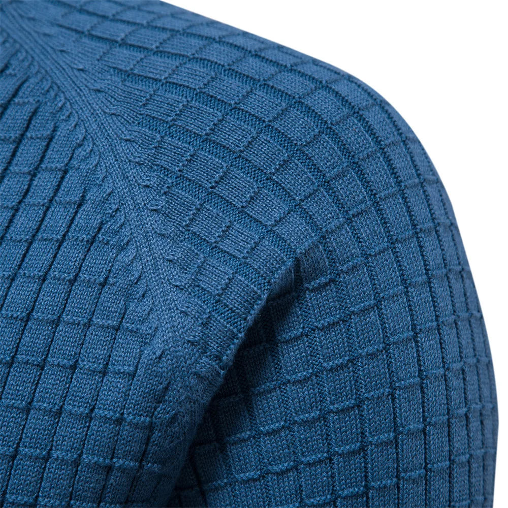 Neatly folded blue Felix men's jumper. A classic crewneck pullover for everyday comfort and versatile style.
