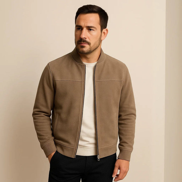 Men's classic fit suede bomber jacket with zip-up front and ribbed cuffs. Perfect fall outerwear.
