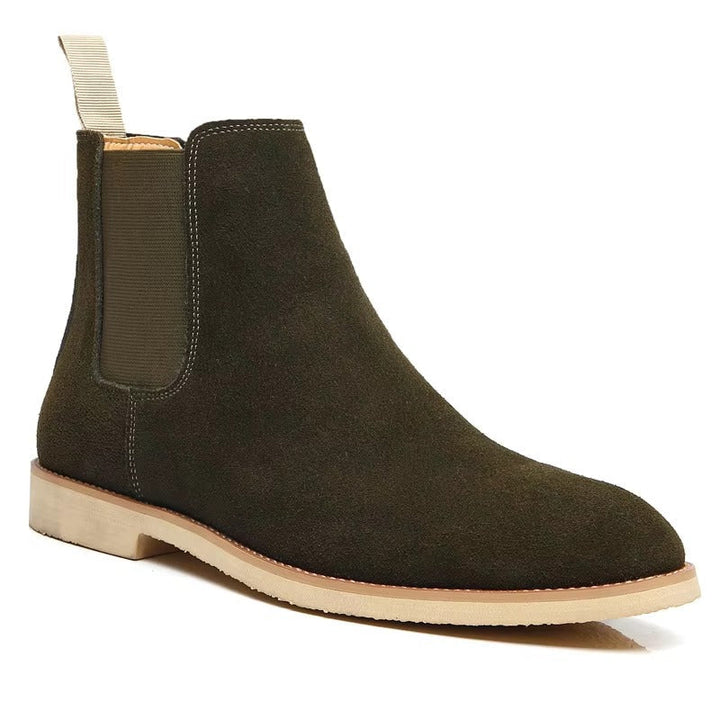 Comfortable men's slip-on ankle boots, featuring minimalist Chelsea style, great for versatile casual footwear.