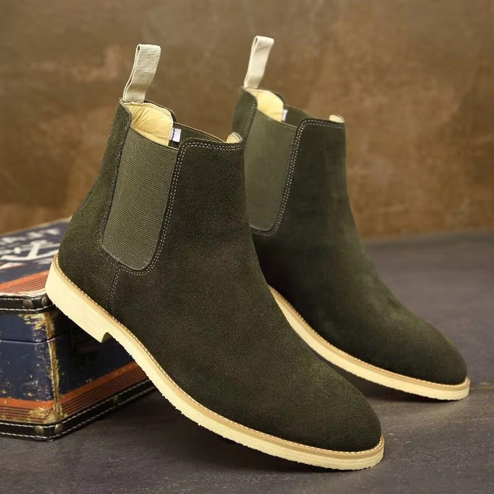 Elegant men's brown leather Chelsea boots, slip-on ankle style, offering a sophisticated look for dress boots.