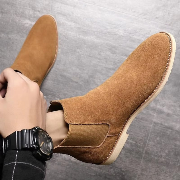 Sophisticated men's black Chelsea ankle boots, slip-on style, perfect for office wear & smart casual outfits.