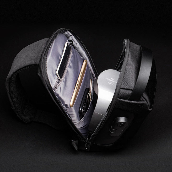 Versatile men's water-resistant messenger bag, compact, anti-theft & integrated USB charging.
