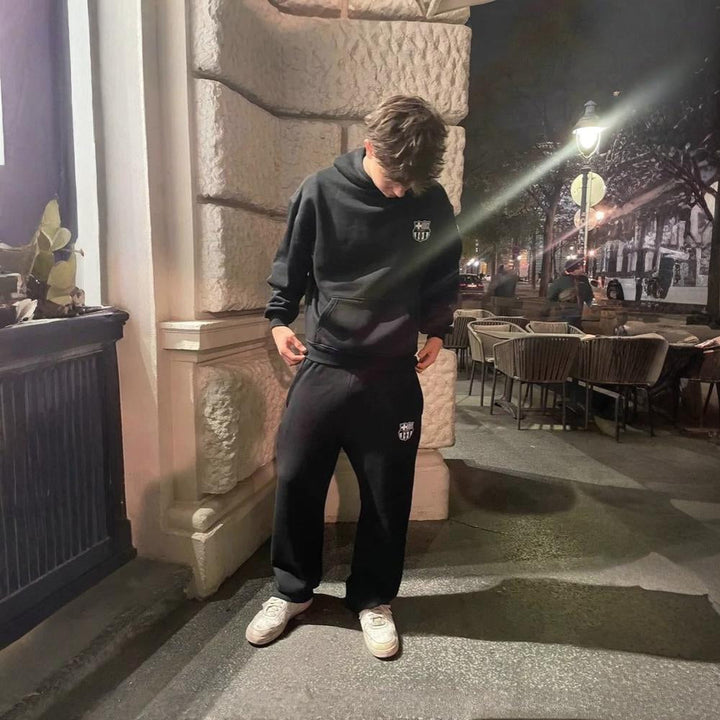 One-piece men's full body hooded tracksuit, offering head-to-toe comfort as sleepwear or loungewear.