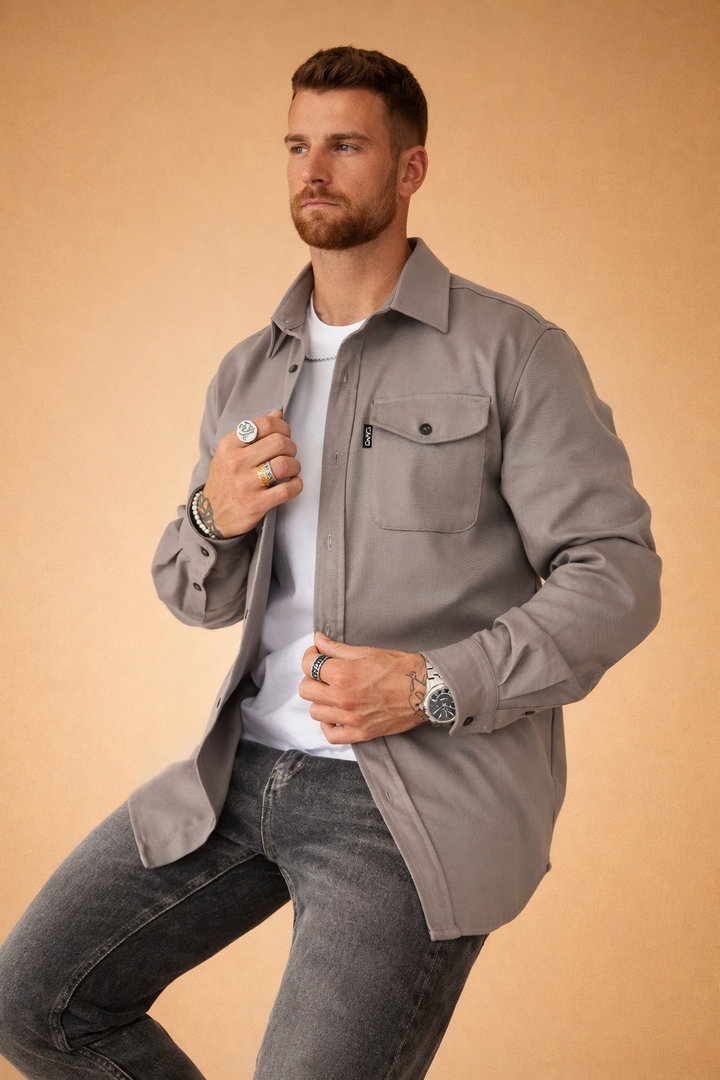 Men's long-sleeve polo shirt with a tailored, modern fit. Utilitarian design for a refined smart casual look.