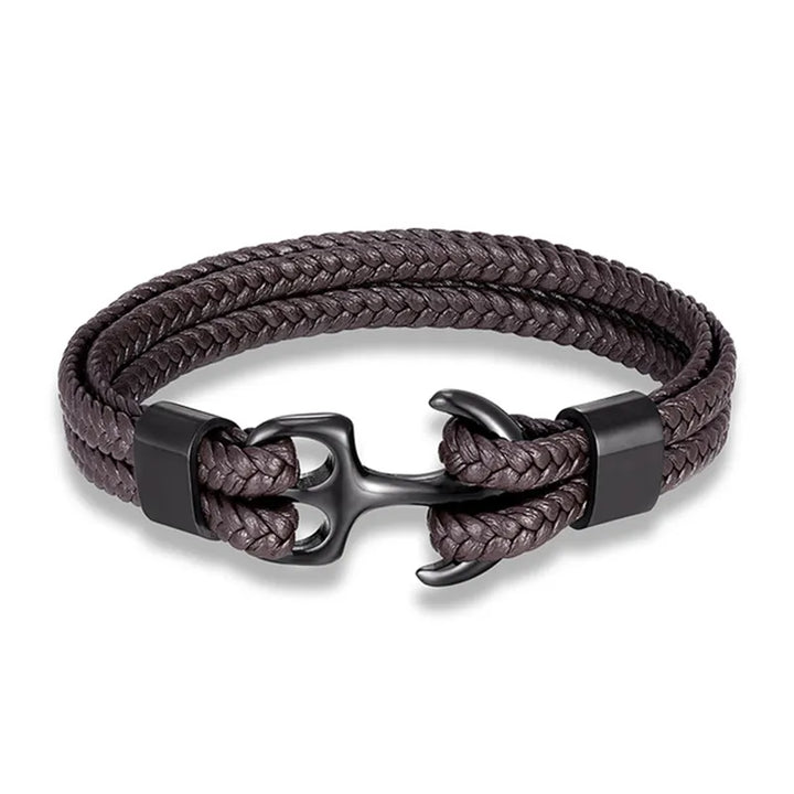 Close-up: Detailed stainless steel anchor charm on a stylish men's black leather bracelet.