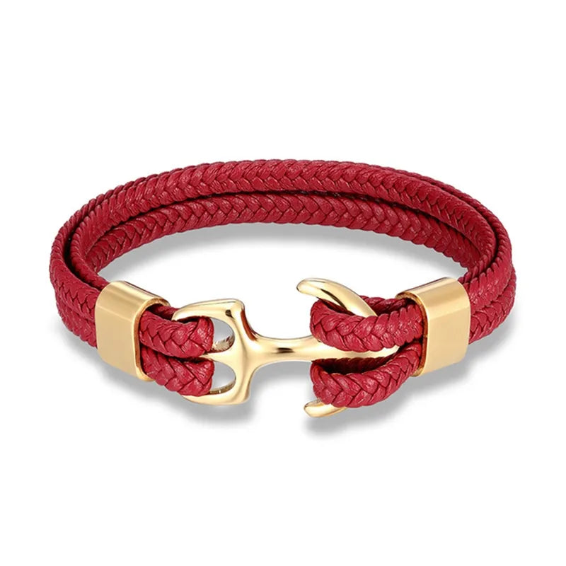 Men's hand wearing a fashionable nautical anchor leather bracelet, ideal for casual outfits.
