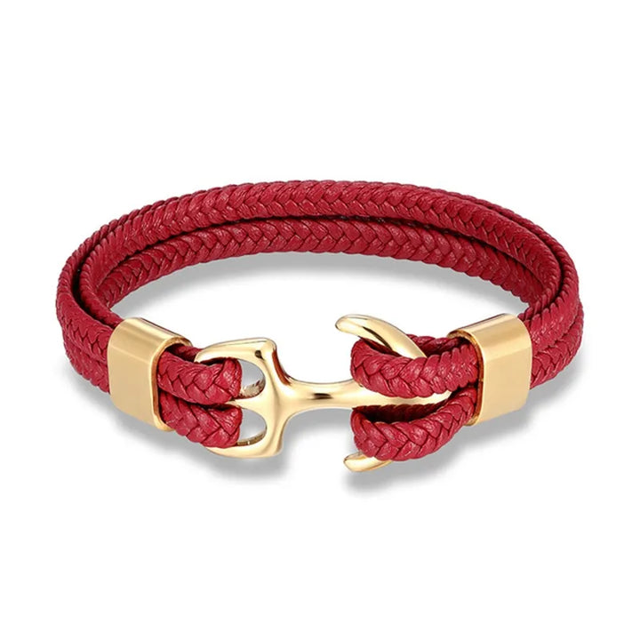 Men's hand wearing a fashionable nautical anchor leather bracelet, ideal for casual outfits.
