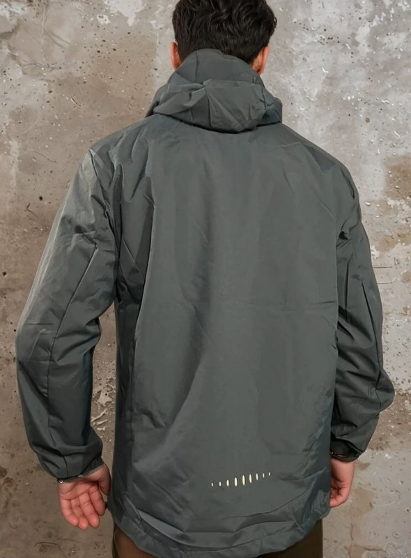 Durable men's waterproof hooded rain jacket with secure pockets. Perfect windproof outerwear for men.