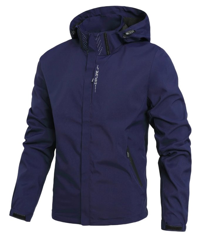 Man wearing a men's hooded rain jacket outdoors. Waterproof, windproof, lightweight, with secure pockets.