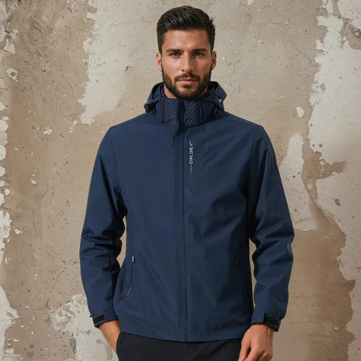 Detail of secure zip pockets on a men's waterproof hooded rain jacket. Ideal outdoor activewear.