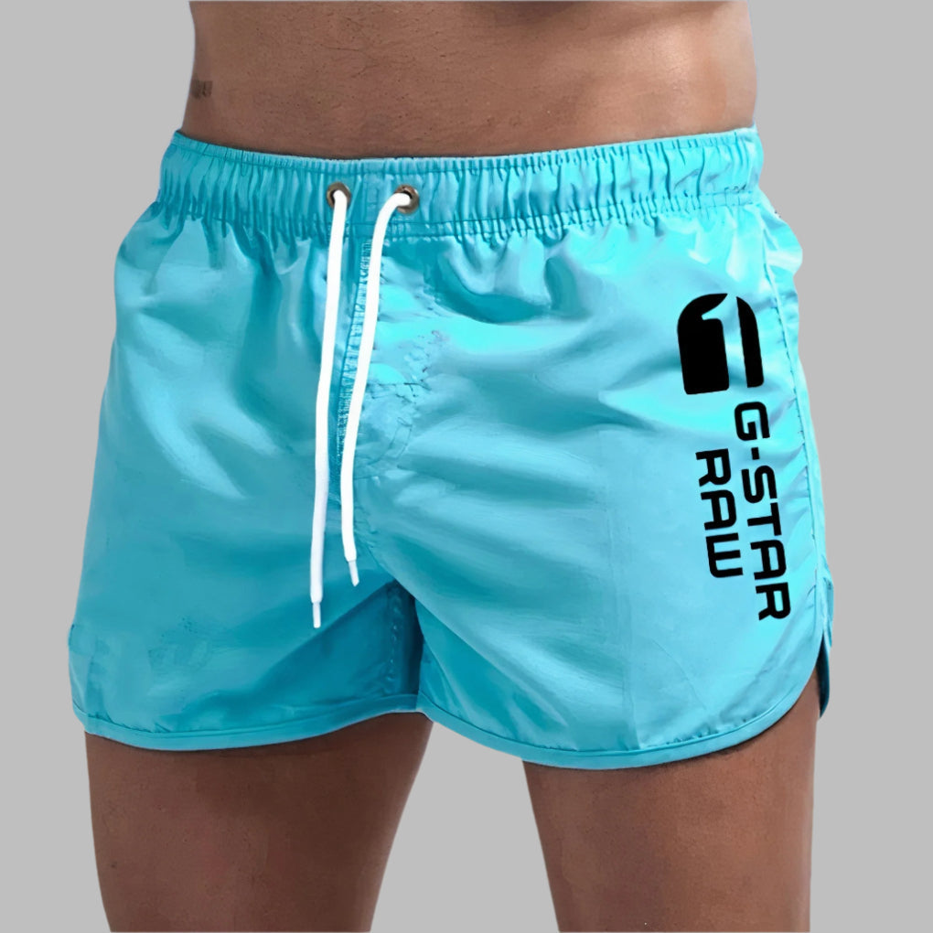 Men's quick-dry athletic swim trunks, ideal for swimming, beach, and active summer wear. Lightweight & comfortable.