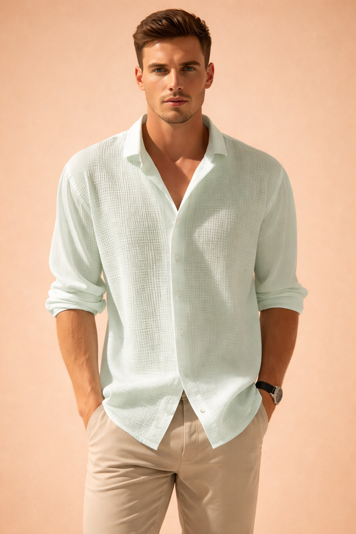 Stylish men's relaxed fit button-up shirt with long sleeves, offering versatile casual elegance for any occasion.