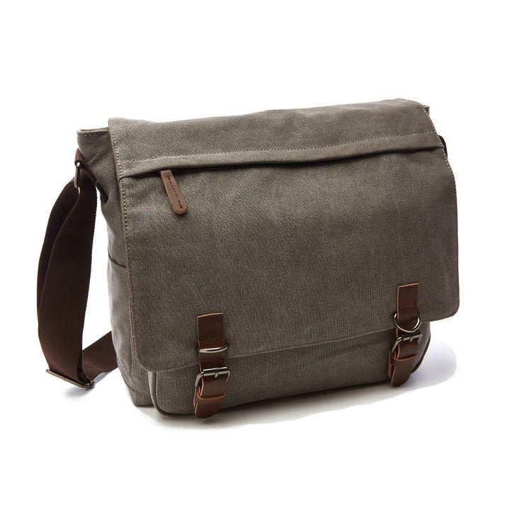 Practical men's canvas shoulder bag with adjustable strap and spacious compartments for versatile everyday and travel use.