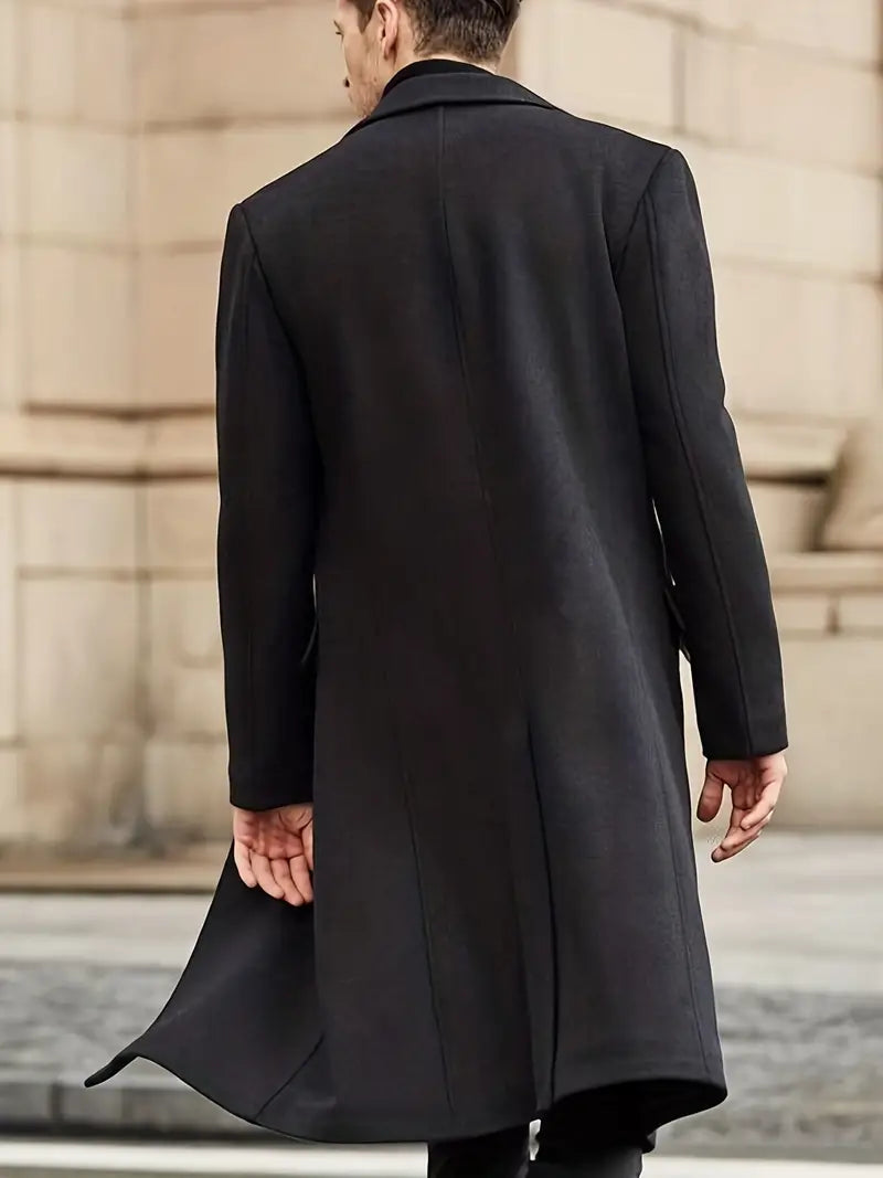 Tailored men's long trench coat, slim fit design, features a sophisticated notched lapel. Versatile outerwear.