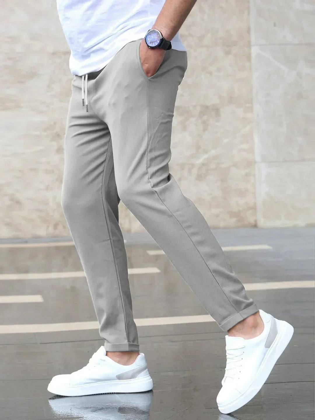 Comfortable men's black slim-fit stretch trousers, ideal for modern workwear or smart casual outfits.