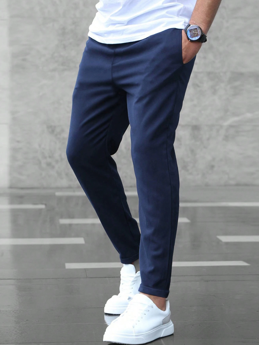 Versatile men's slim-fit stretch pants, easy care for a modern, comfortable look in blue.