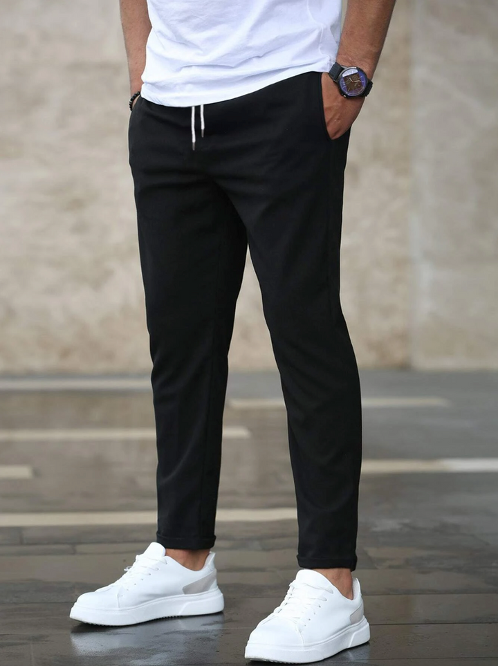 Sleek men's slim-fit stretch work pants, providing comfort and a professional business casual look.