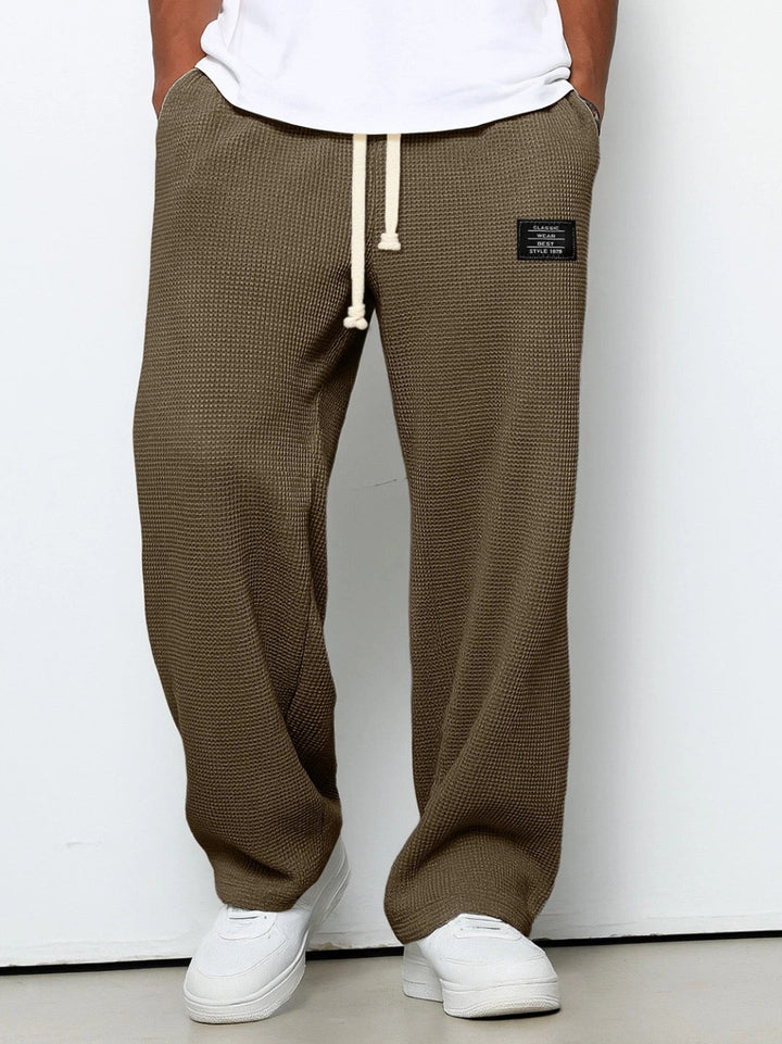 Men's athletic jogging pants, relaxed fit for gym workouts, activewear, and comfortable movement.