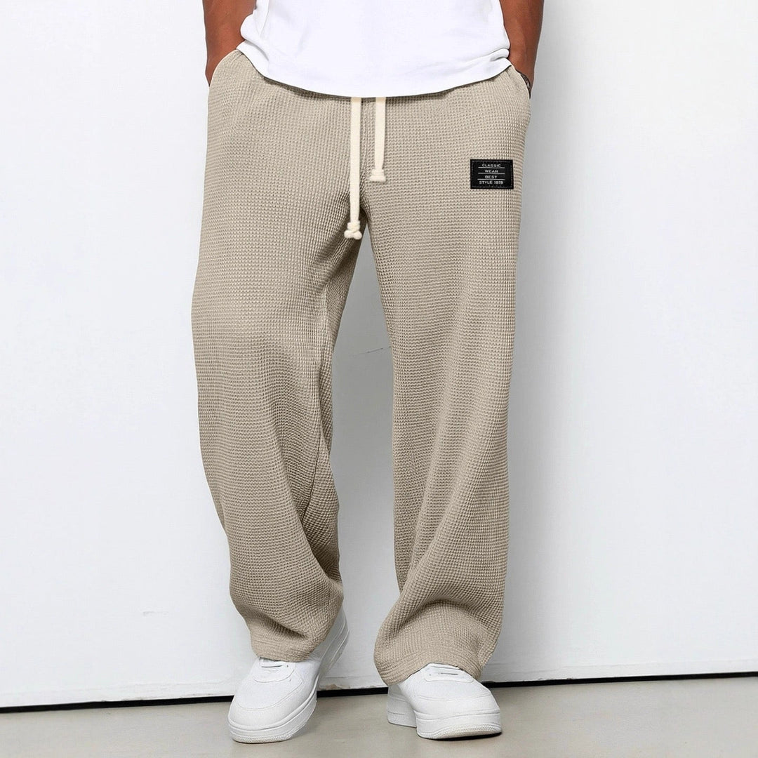 Man wearing stylish relaxed fit jogging pants, perfect activewear for gym or casual outings.