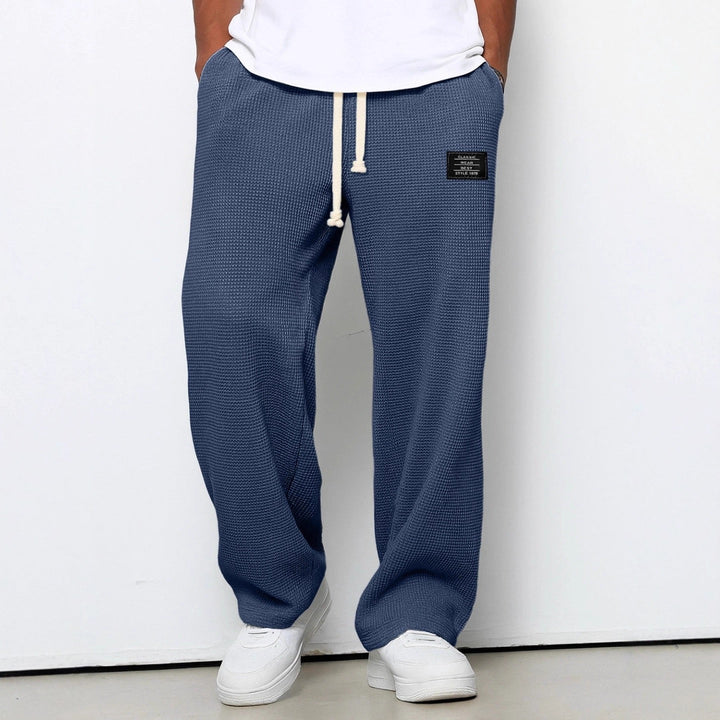 Folded men's soft jogging pants, ideal casual activewear for everyday comfort and style.